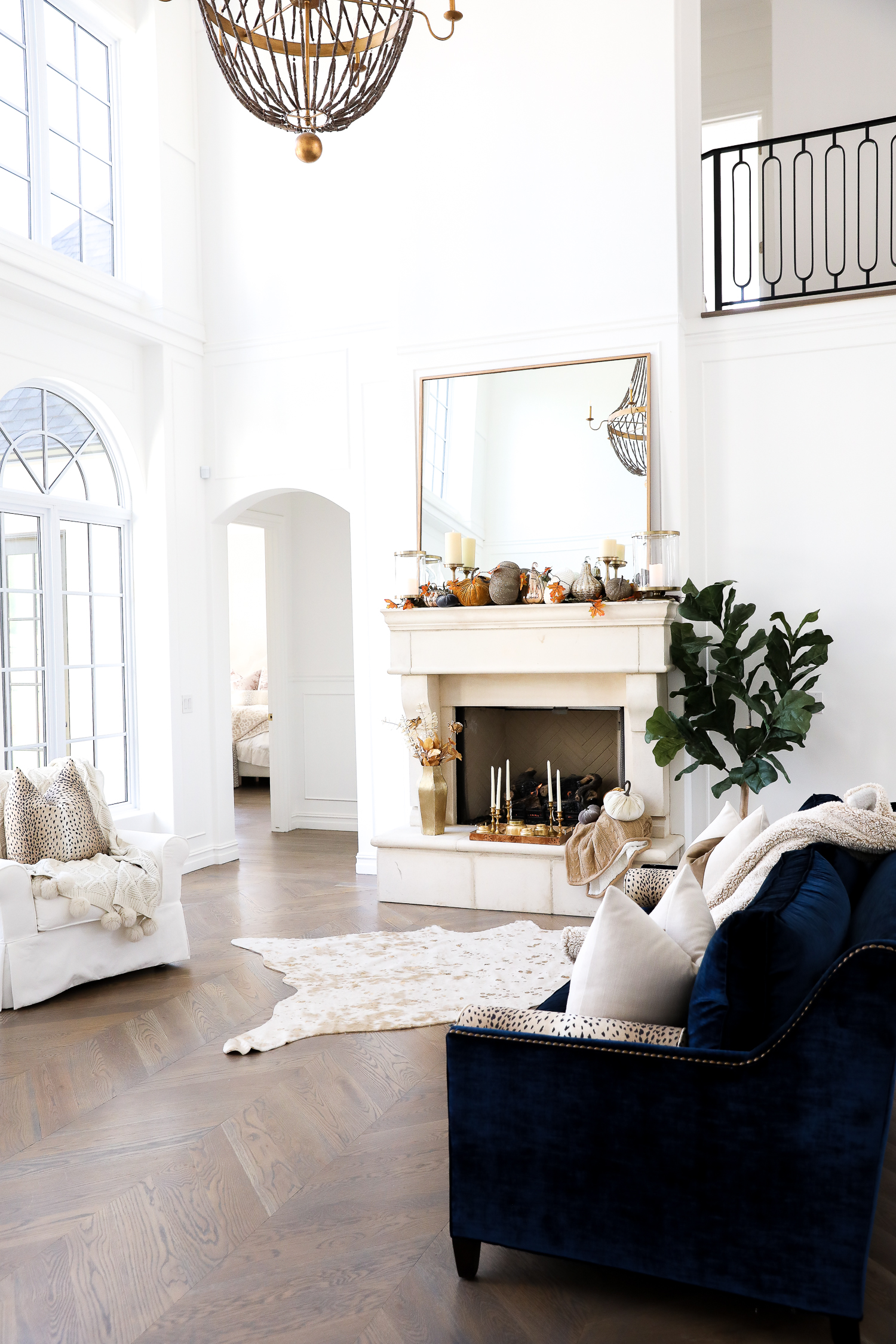 little design co leopard bolster couch, navy sofa, rob key designs mirror, Emily gemma home, fall home decor inspiration pinterest