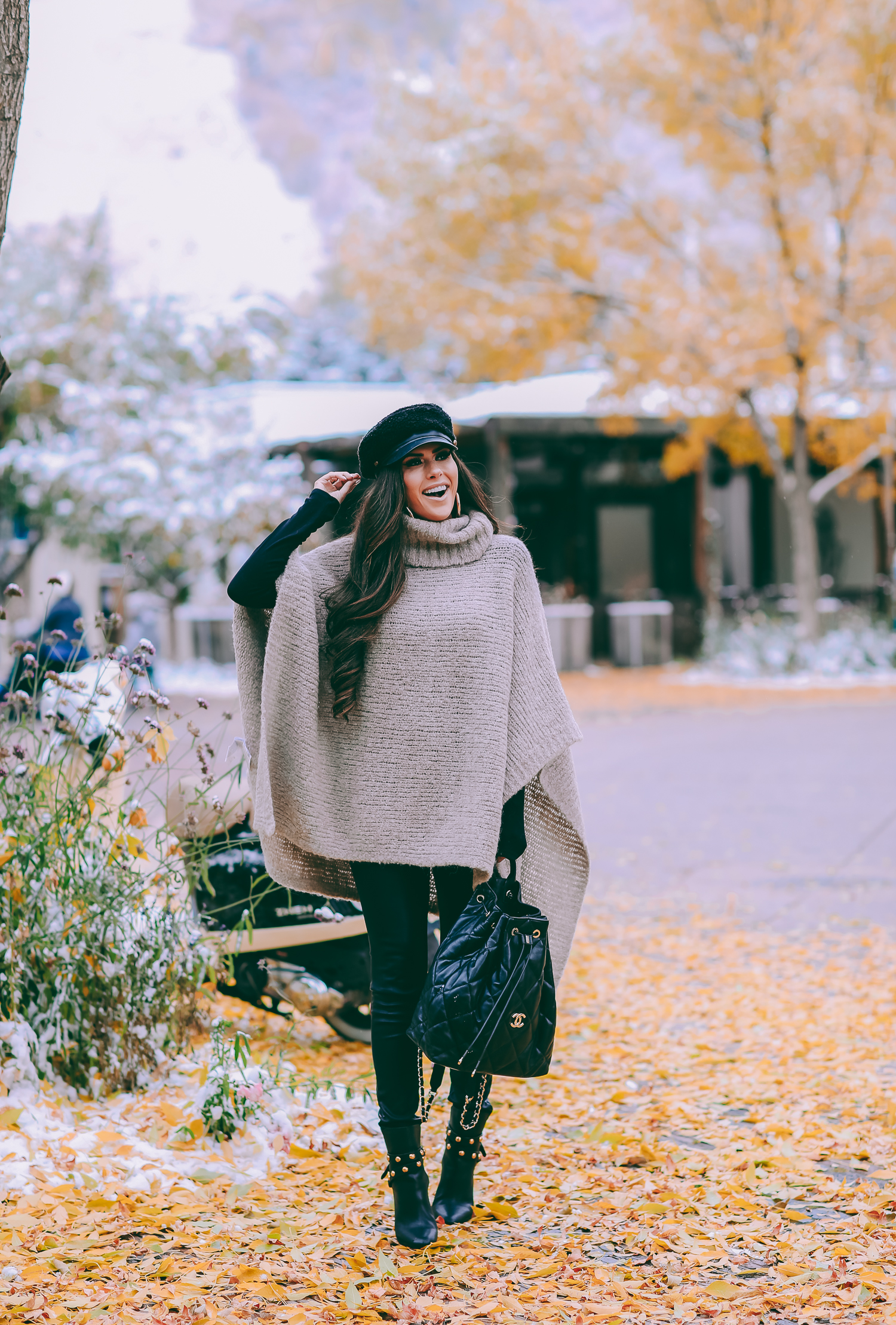 Cute snow day outfits styled by top US fashion blog, The Sweetest Thing: image of a woman wearing a Caslon black top, BlankNYC pants, See by Chloe boots, Leith baker boy cap, and a Chanel backpack | winter 2019 fashion outfits pinterest, mango cape poncho, chanel black quilted backpack, aspen fashion blogger, emily gemma, cute outfits for aspen-2