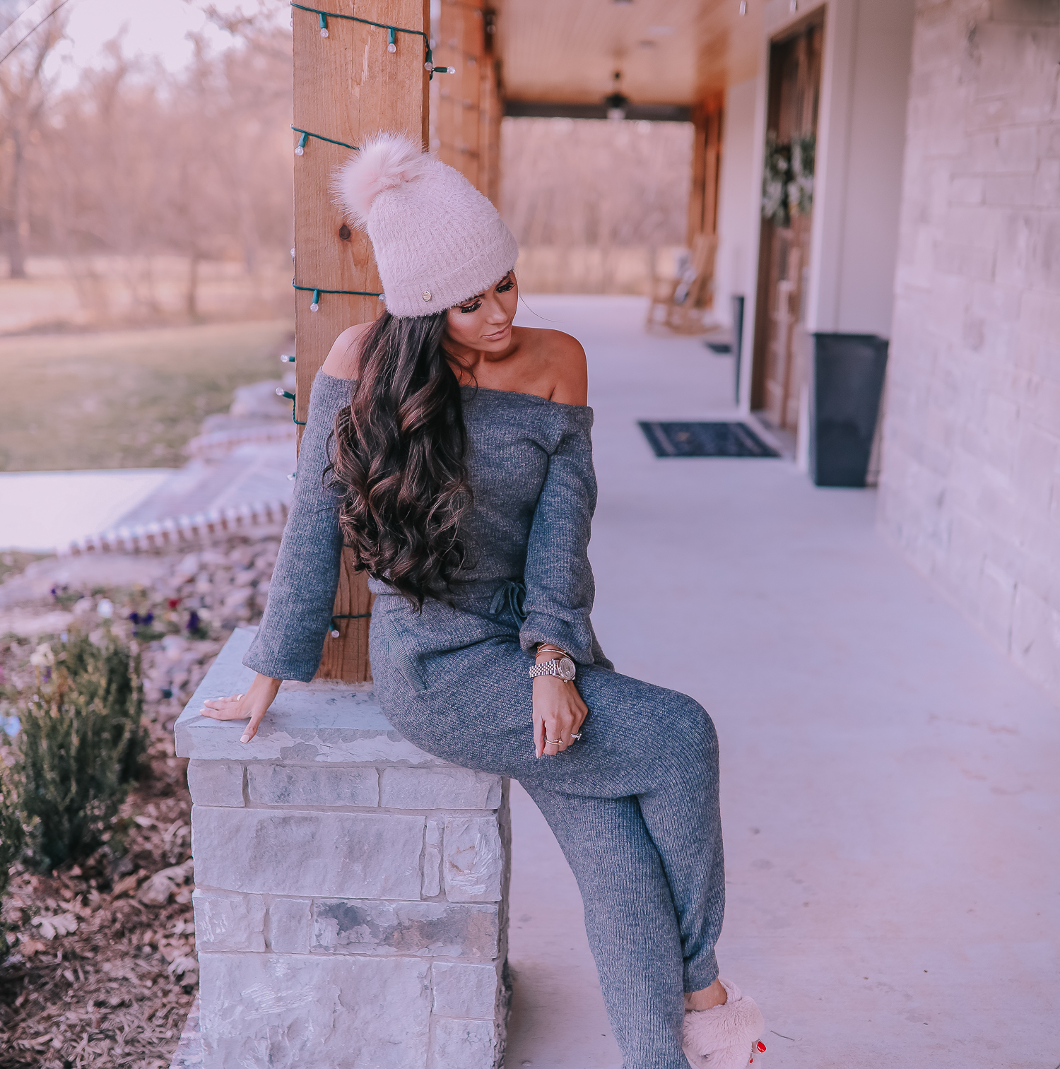 The Perfect Cozy Holiday Outfit [50% Off!] by popular Oklahoma fashion blog, The Sweetest Thing: image of a woman wearing an Express High Waisted Cozy Sweater Jogger Pant, Express Cozy Cropped Ribbed Sweater, Express Metallic Cable Knit Pom Beanie, and Express Criss-Cross Gem Embellished Faux Fur Slippers.