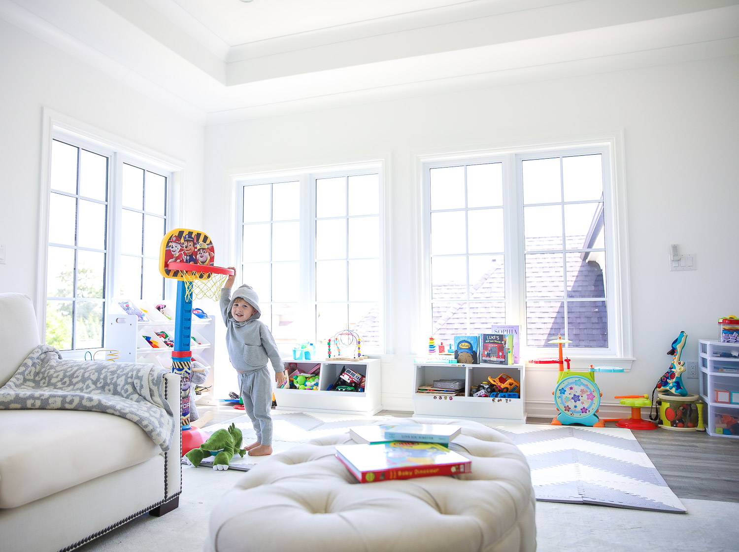 walmart kids home organization must haves, playroom organization ideas, emily gemma, the sweetest thing blog | Playroom Organization by popular US life and style blog, The Sweetest Thing: image of a playroom set up with a Walmart Humble Crew Super-Sized Toy Organizer with 16 Plastic Bins, foam flooring, basketball hoop, rocking elephant, and Walmart Badger Basket Two Bin Stackable Storage Cubby.