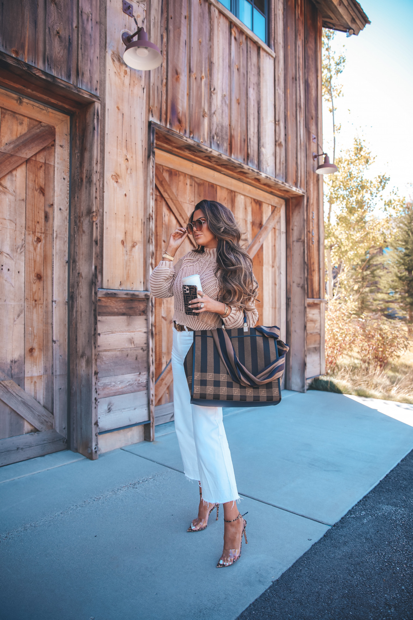 fall fashion outfits 2020 pinterest, Fendi Sunshine shoper tote with silk strap, emily gemma |Fall Clothing by popular US fashion blog, The Sweetest Thing: image of a woman wearing a Nordstrom Sweetheart Mock Neck Sweater FREE PEOPLE, H&M Culotte High Ankle Jeans, Rolex Watch, Gianvito Rossi Stark Leopard-Print Leather & PVC Sandals,FENDI SUNSHINE LARGE, Louis Vuitton belt, Fendi STRAP YOU Silk shoulder strap,Dior DiorSociety2F 60MM Round Sunglasses, and holding a phone in a IPHONE 11 PRO CASE.