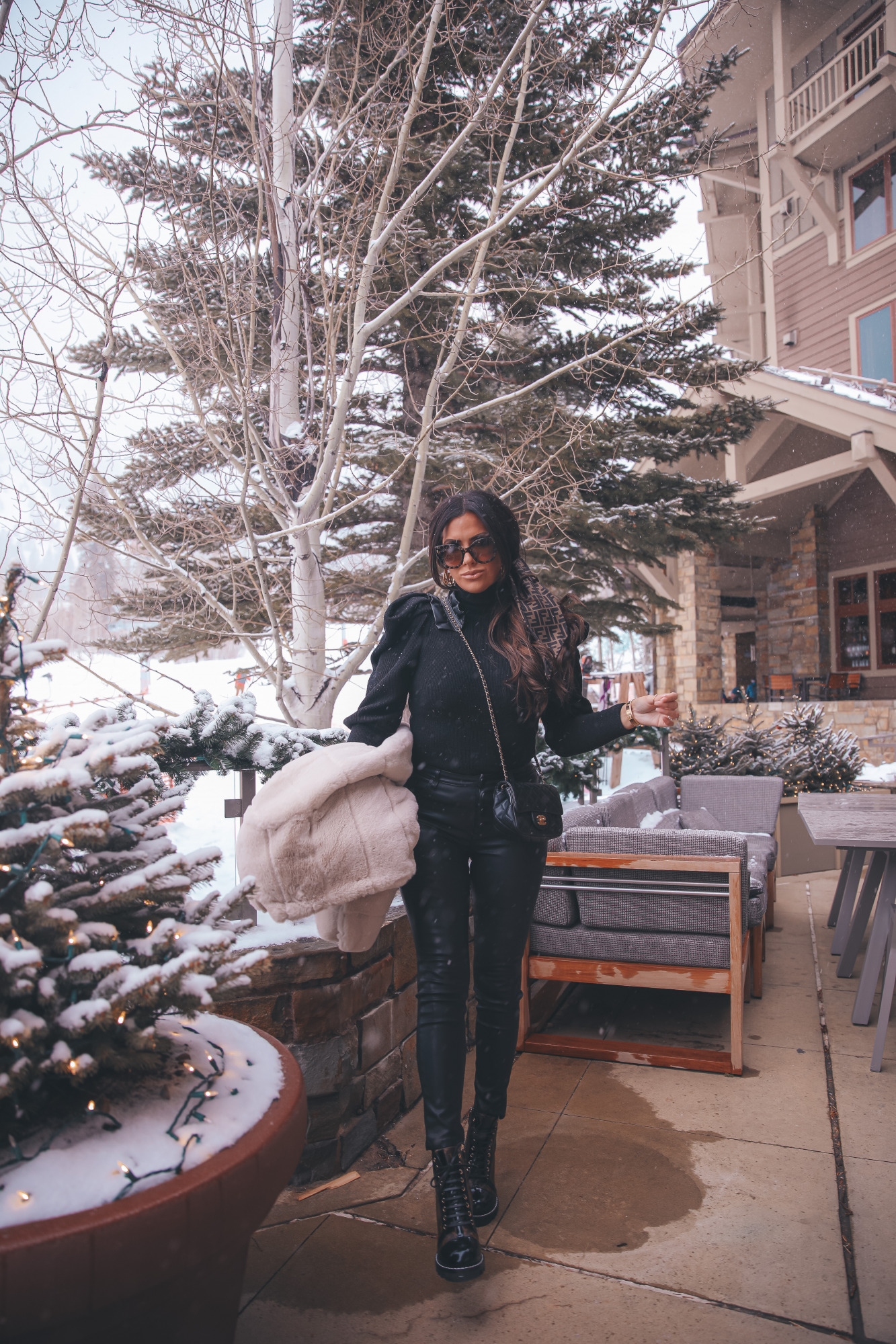 fendi hair scarf scrunchie, Louis Vuitton Star Trail Ankle Boot, Louise Hoop Earrings, Fendi Roma Sunglasses, Emily Gemma, the sweetest thing blog |Jackson Hole Winter by popular US fashion blog, The Sweetest Thing: image of Emily Gemma wearing a BB Dakota tan faux fur coat, black Express ruffle shoulder top, Fendi sunglasses, Black BlankNYC faux leather leggings, Louis Vuitton boots, Fendi hair scarf, Louis Vuitton earrings, and a Chanel black quilted purse.